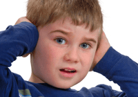Child covering ears with hands