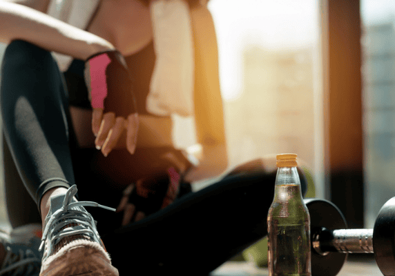 Athlete relaxing in gym setting