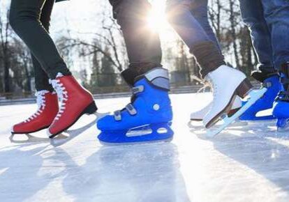 Ice skaters gliding in the sun