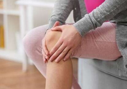 Woman experiencing knee discomfort