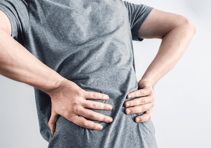 Man experiencing lower back discomfort