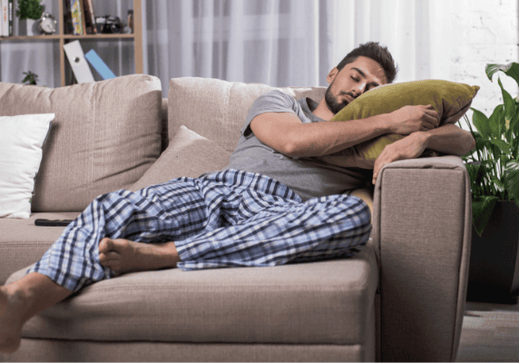 Relaxing on sofa in plaid pajamas