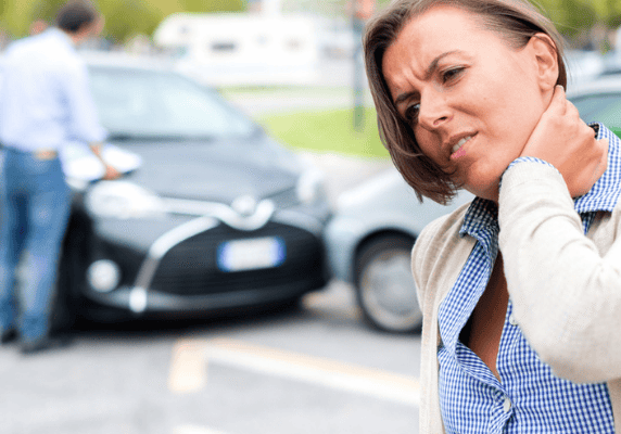 Car accident scene with injured woman