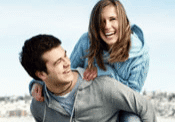 Joyful pair laughing in the snow.