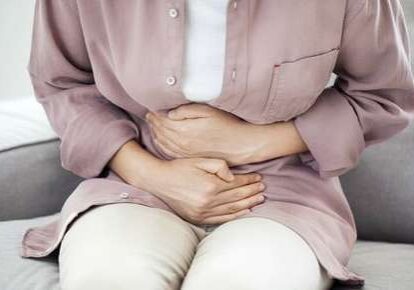 Woman experiencing abdominal pain