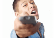 Man holding remote, shouting