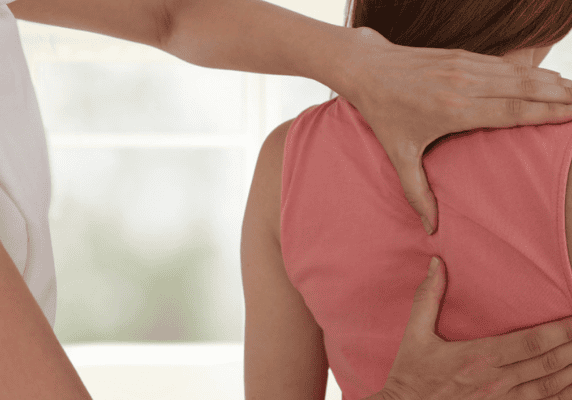 Woman receiving chiropractic treatment