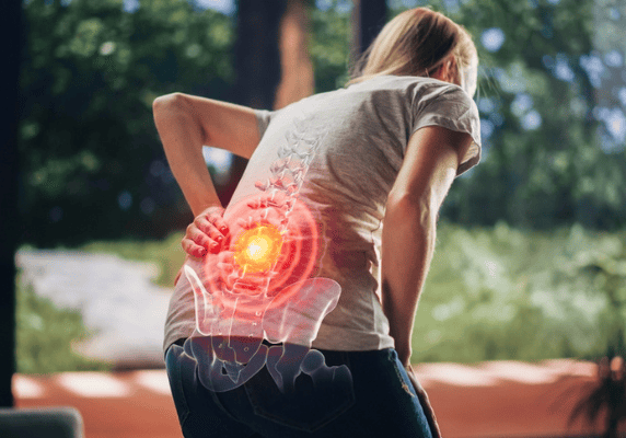 Person experiencing lower back pain