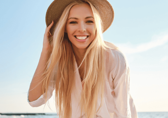 Woman smiling on sunny beach