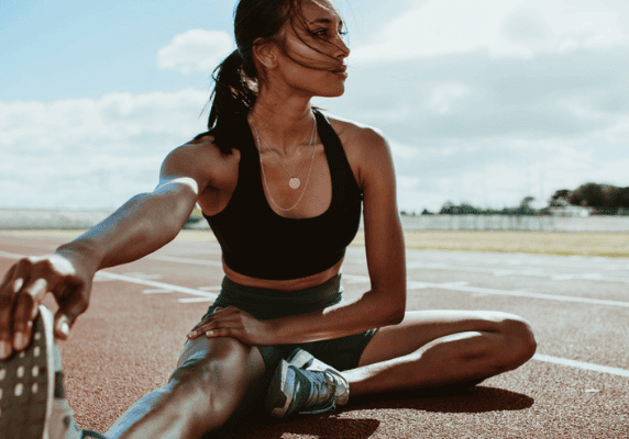 Woman performing leg stretch exercise