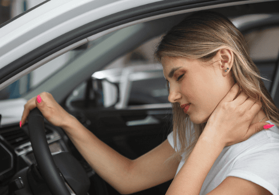 Driver holding neck uncomfortably