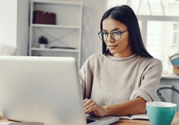 Focused woman using computer indoors