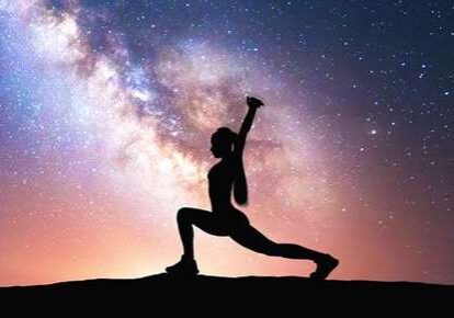 Yoga pose in front of night sky