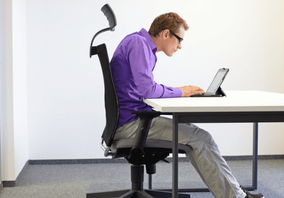 Poor posture while working on laptop